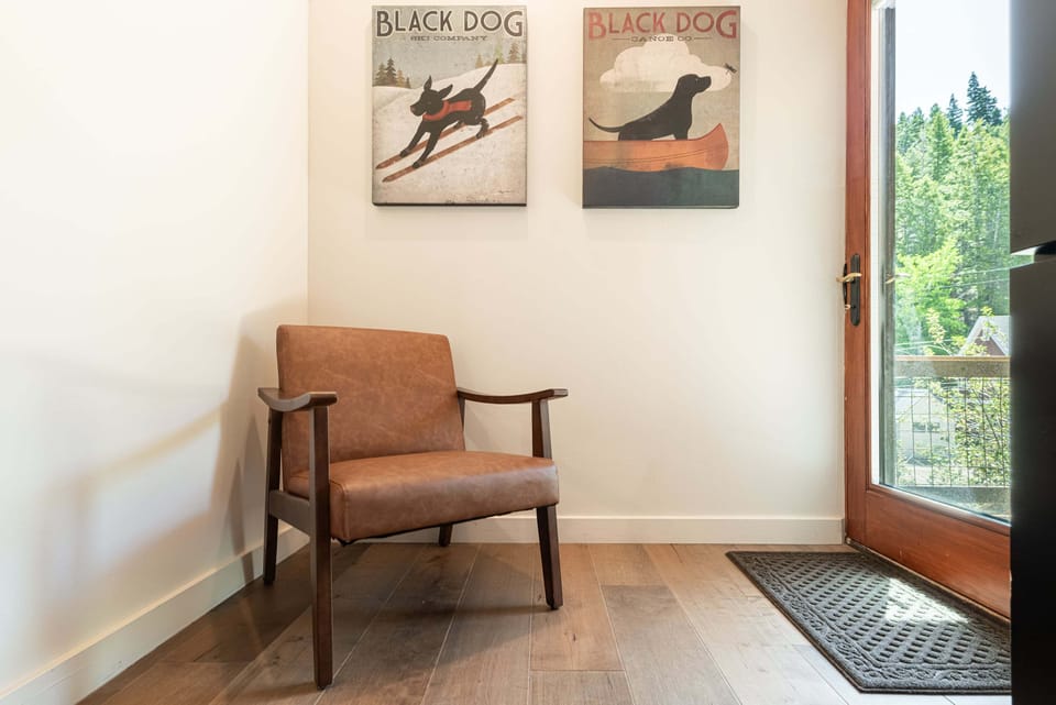 Second-floor second bedroom with queen bed, smart TV, deck access, & jack n jill bathroom