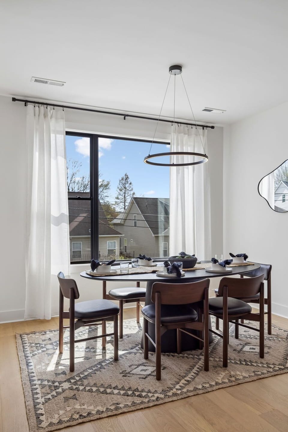 Dining Area: A bright dining space with natural light and an inviting setup.