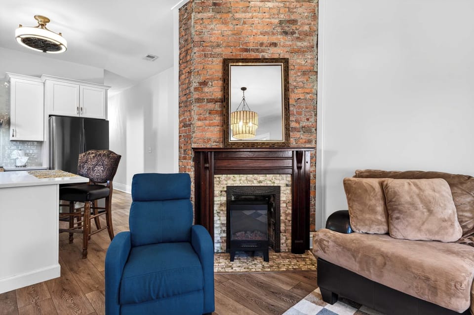 Living Room: Sink into the sectional and let the original-brick fireplace do the rest.