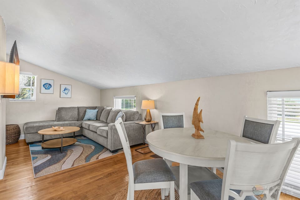 Upstairs landing with game area, ample lounging space, and queen pullout bed!
