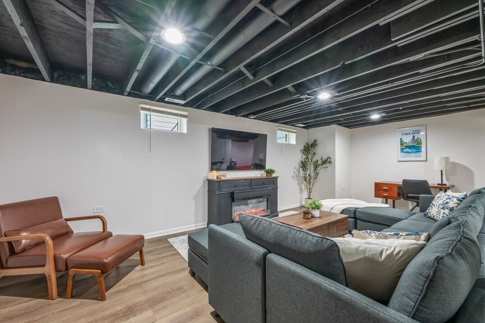 Samsung TV, electric fireplace, kids’ zone, board games stored in the closet, and a dedicated workspace make the lower level a great hang out space.