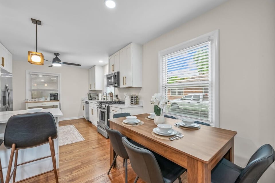 A bright dining spot sits just beyond the kitchen.