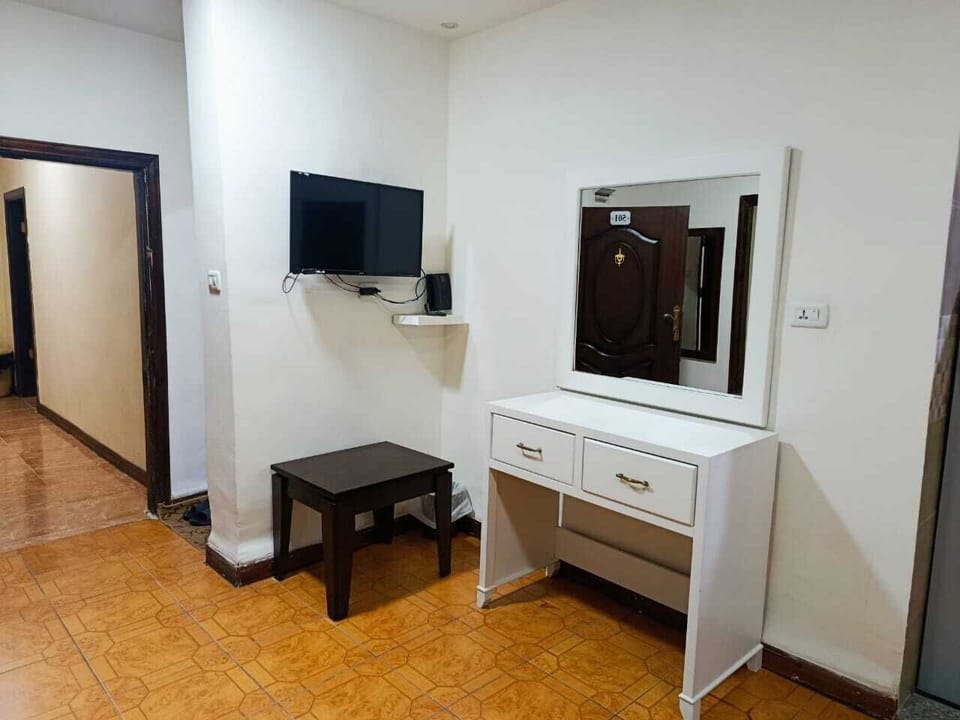 Suite, 2 Bedrooms | Living area | 43-inch flat-screen TV with satellite channels, printers