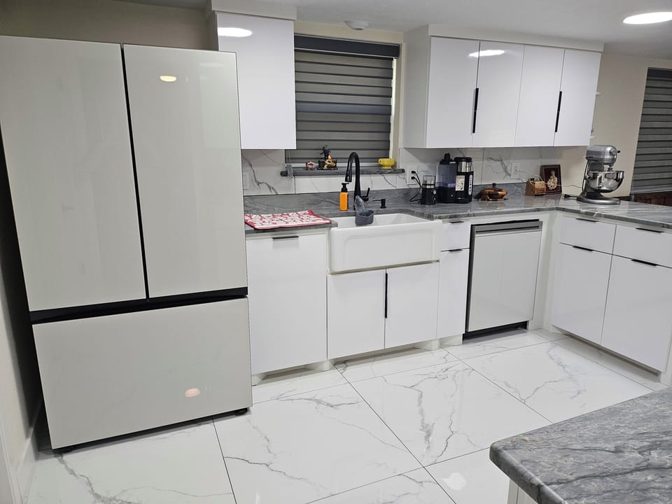 Kitchen sink, refrigerator, and dishwasher.