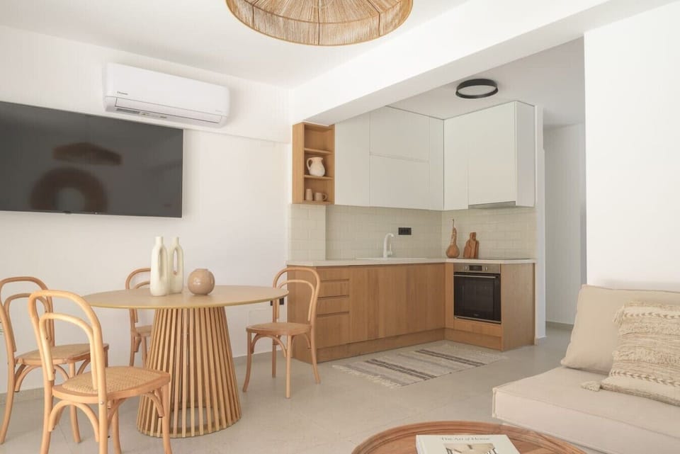 Modern open living space with fully equipped kitchen.