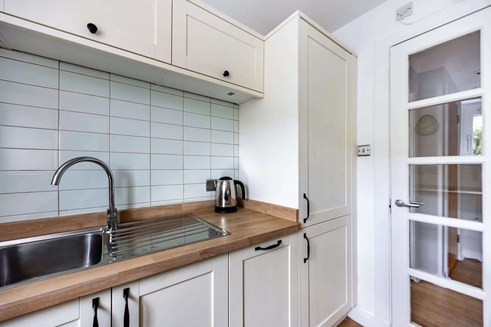 The kitchen is fully equipped to prepare a simple meal 