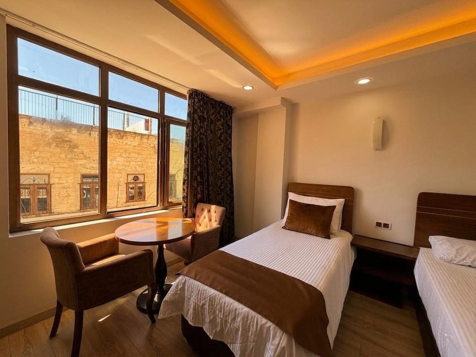 Family Quadruple Room, City View | WiFi (free), bed sheets