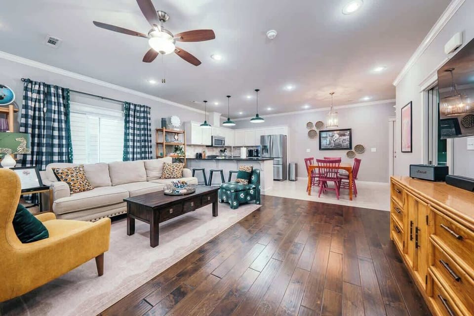 Enter our home to find the colorful and open living space complete with seating, a Smart TV, a fully stocked kitchen, and a dining table for 6.