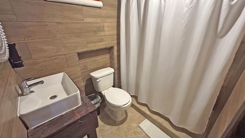 Basic Double or Twin Room | Bathroom | Bathtub, towels, soap, shampoo