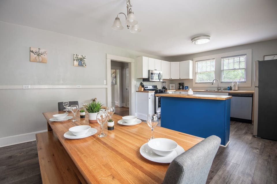 The kitchen stays within reach while this inviting dining space gives your group room to sit down, share a meal, and catch up on the day.