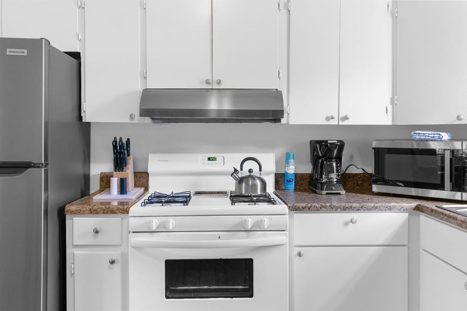 Start your mornings here—coffee brewing, breakfast going, and everything you need within reach
