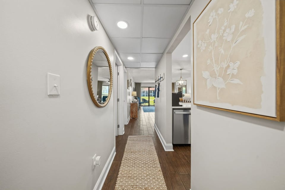 Our villa's welcoming entryway with coat hooks, umbrellas and a key to our locked outdoor storage bin