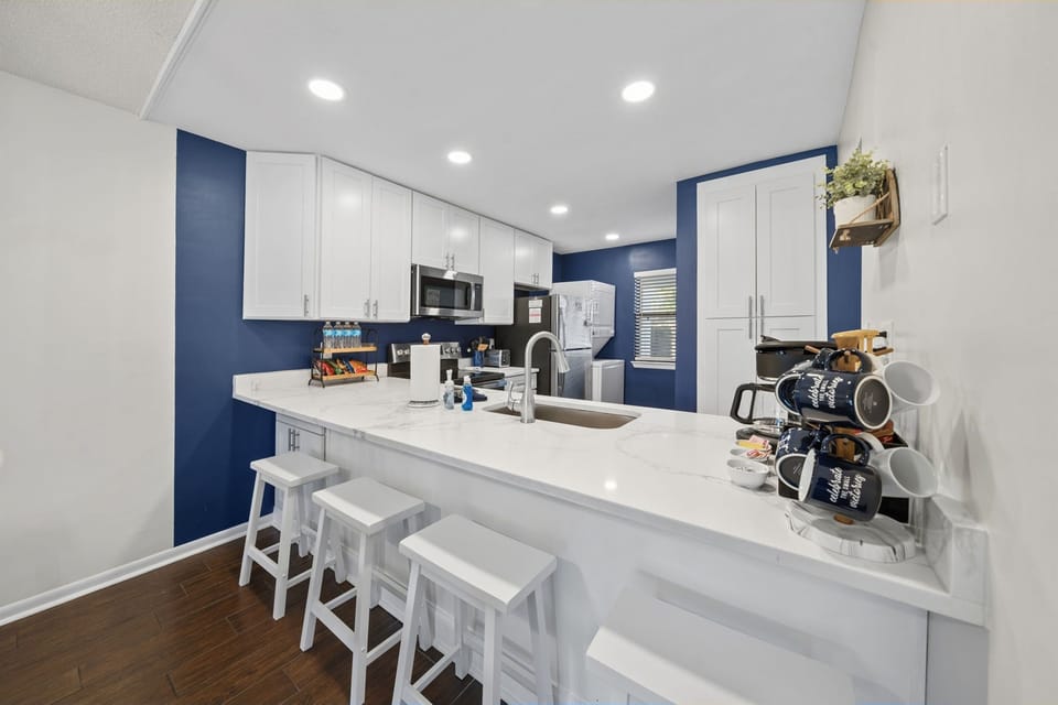 Updated full kitchen equipped with everything you need for home-cooked meals, along with a convenient stackable washer/dryer