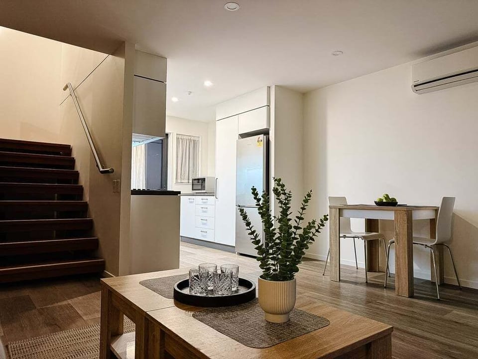 Dining table for two downstairs — fits a proper sit-down dinner, not just a perch for takeaway.
