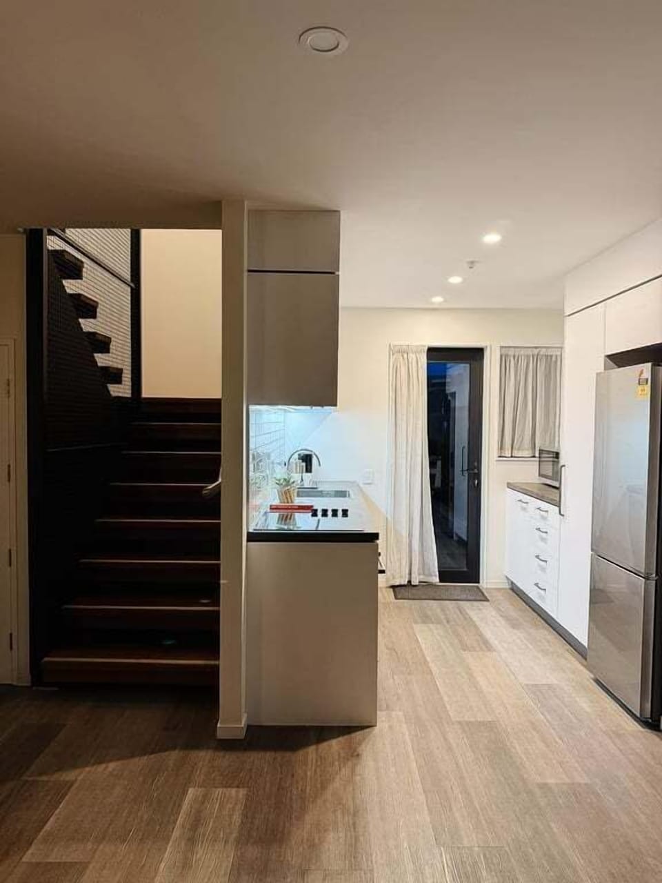 Kitchen — galley-style, well-lit, set up for cooking actual meals.