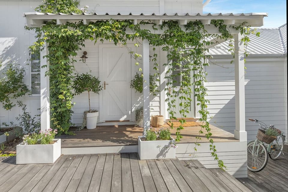 The Barn - a self-contained private retreat within Farmhouse Hunter Valley. Separate entrance, king bedroom, twin rainfall shower ensuite, kitchenette, workspace and gas log fireplace with sitting area.