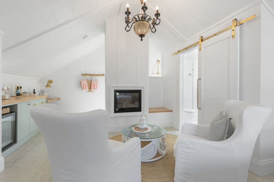 A comfortable sitting area by the gas log fireplace for a glass of wine or hot chocolate, or to plan your day amongst the vineyards and restaurants