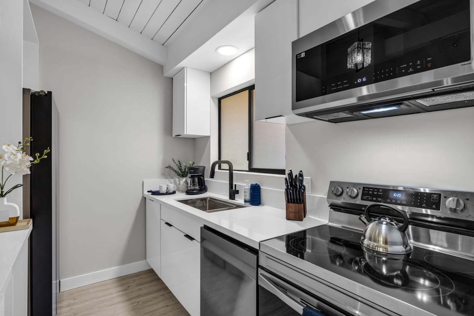 Modern kitchen featuring stainless steel appliances and upgraded finishes