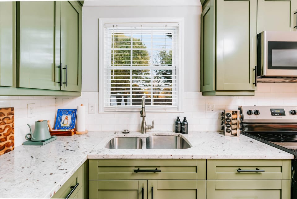 Every detail was intentional — from the sage green cabinets to the marble countertops and premium finishes. Cooking here doesn't feel like a chore. 🌿