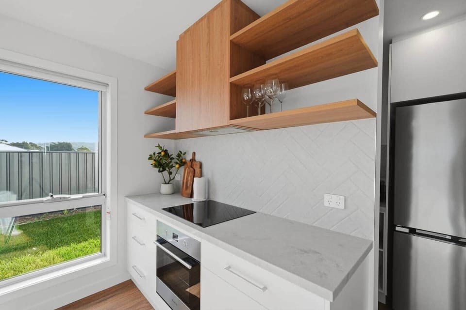 Stylish open kitchen with quality appliances in this Tasmania holiday accommodation.