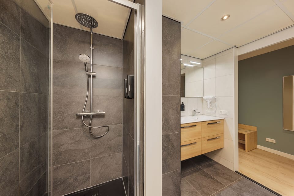 Superior Room | Bathroom | Hair dryer, towels, toilet paper
