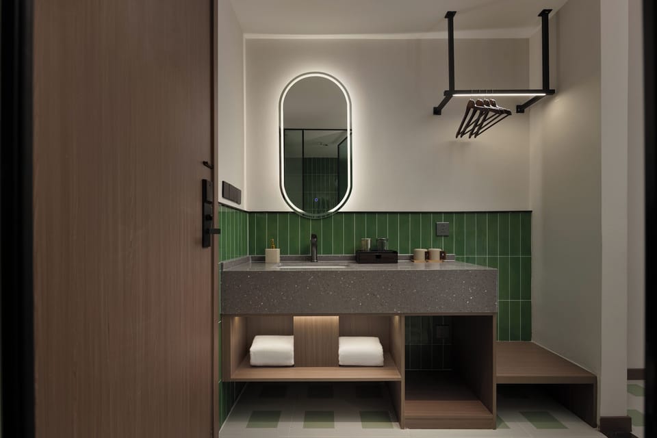 Deluxe Double Room, City View | Bathroom | Shower, free toiletries, hair dryer, slippers