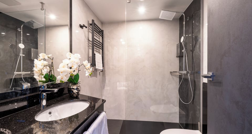 Shower, rainfall showerhead, towels, soap