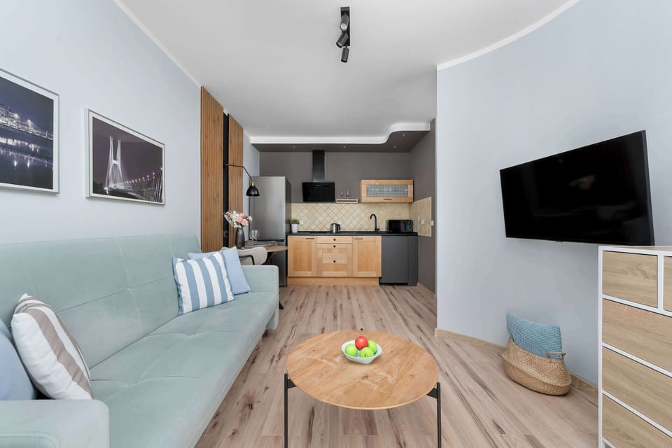 Contemporary living room with TV wall and warm wooden elements