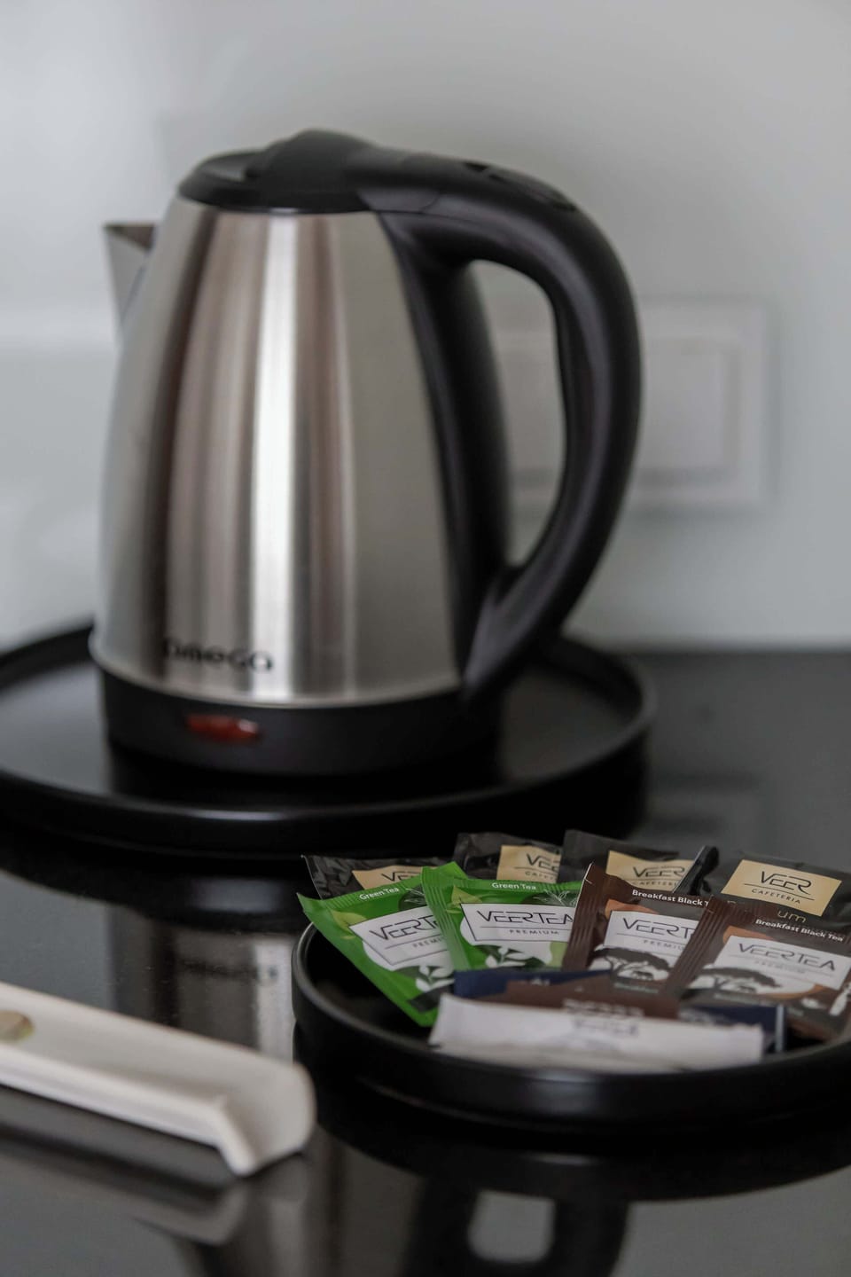Modern electric kettle station with complimentary coffee and tea setup