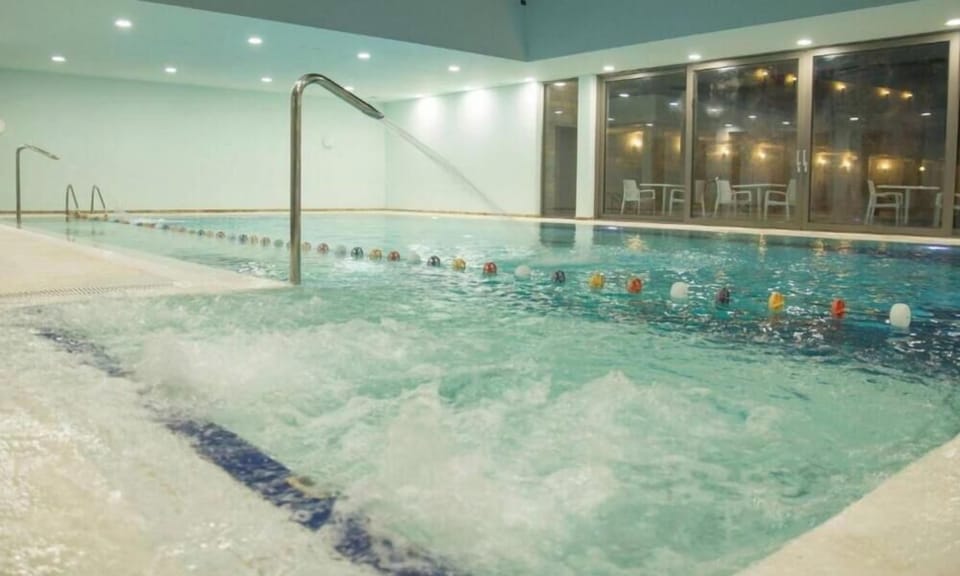 Indoor pool, seasonal outdoor pool, pool umbrellas