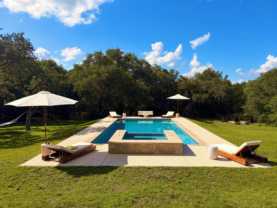 Outdoor pool, pool umbrellas, sun loungers