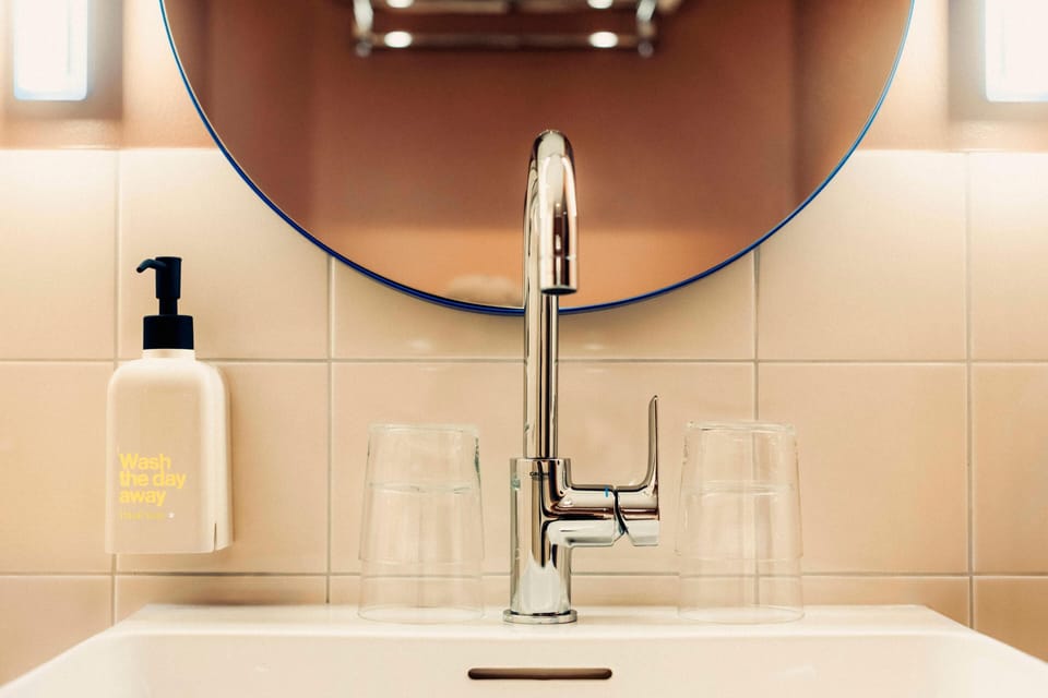 Shower, rainfall showerhead, hair dryer, towels