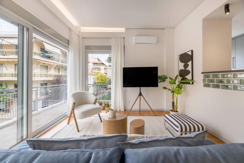 Comfort Apartment, Balcony, City View | Living area | 55-inch Smart TV with digital channels