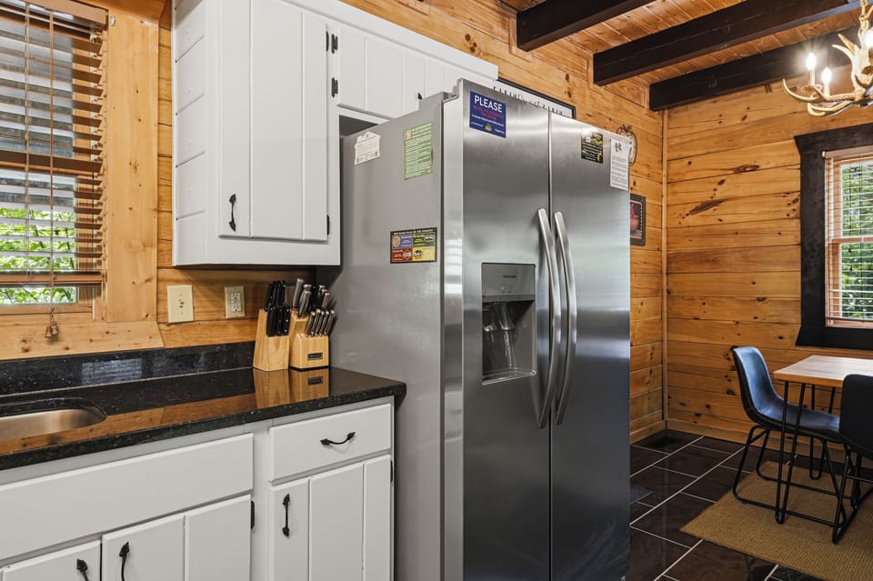 Open kitchen with granite counters and stainless appliances