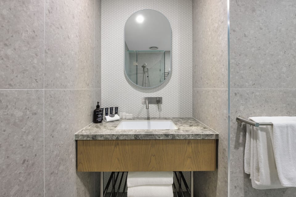 Shower, hair dryer, slippers, towels