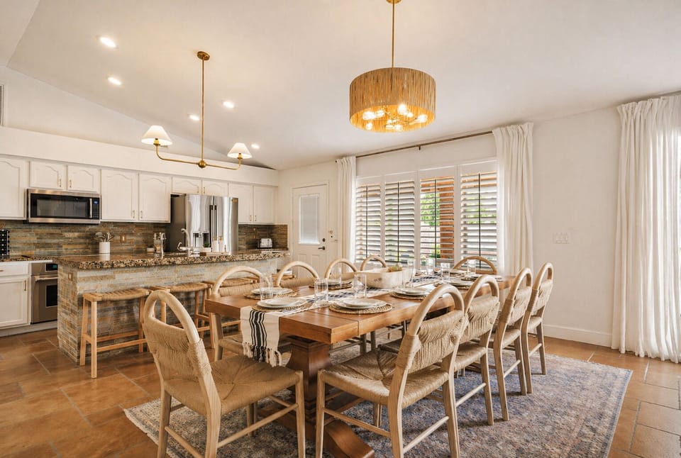 Gather, linger, and dine together—this spacious dining area seats 10 comfortably, with additional bar seating and room to expand for larger groups