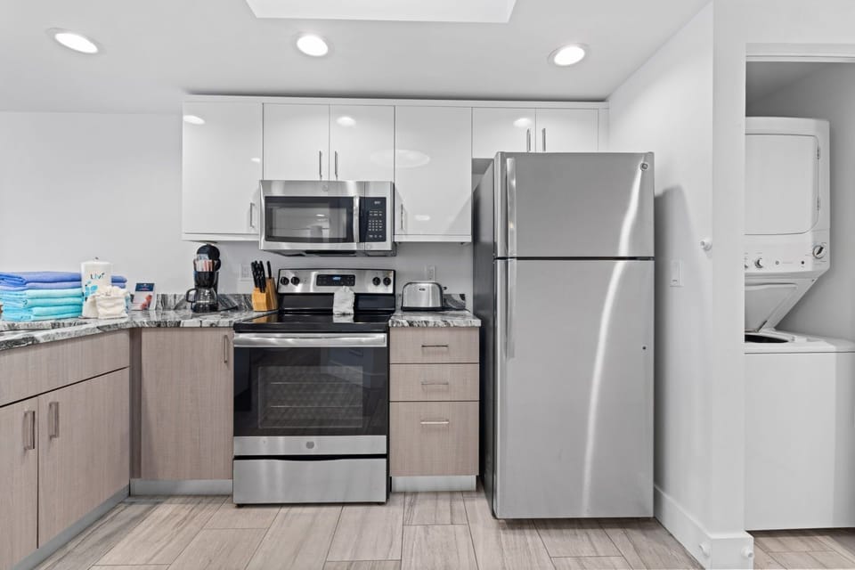 Whip up your favorite meals in this modern kitchen, complete with stainless appliances and a convenient washer/dryer.