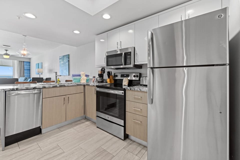 Elevate your culinary experience with a modern kitchen space, brightened by natural light and stylish finishes.