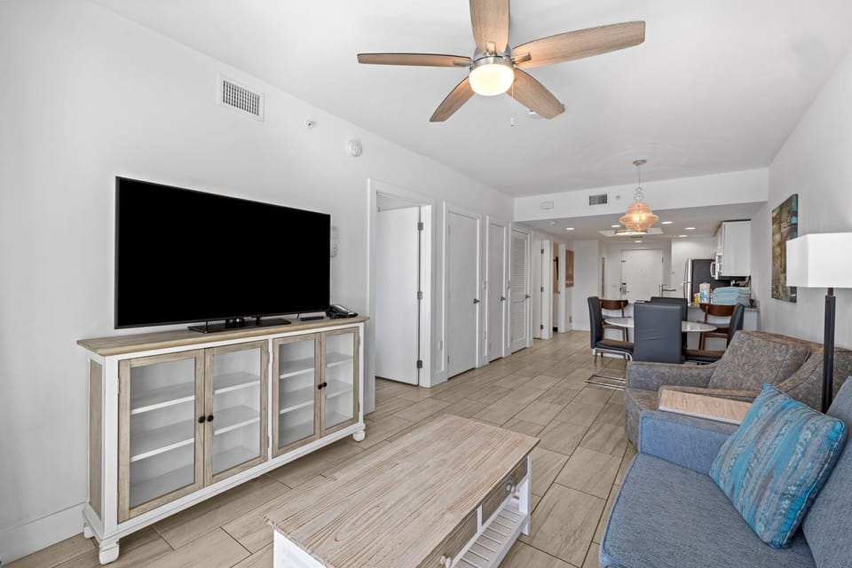 Gather around in this spacious living area, perfect for cozy evenings with the family.