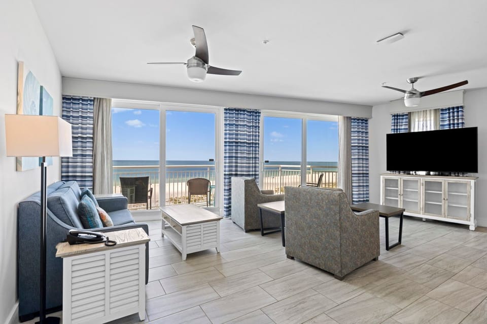 Step into your serene living space, where comfort meets stunning Gulf views through spacious windows.
