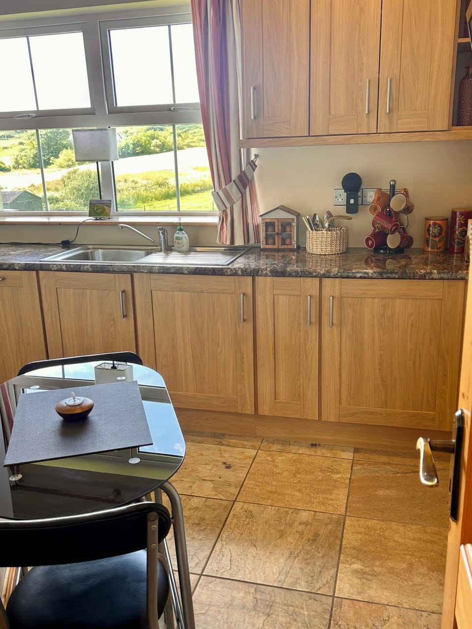 Dining table for two in our kitchen which has everything you could possibly need