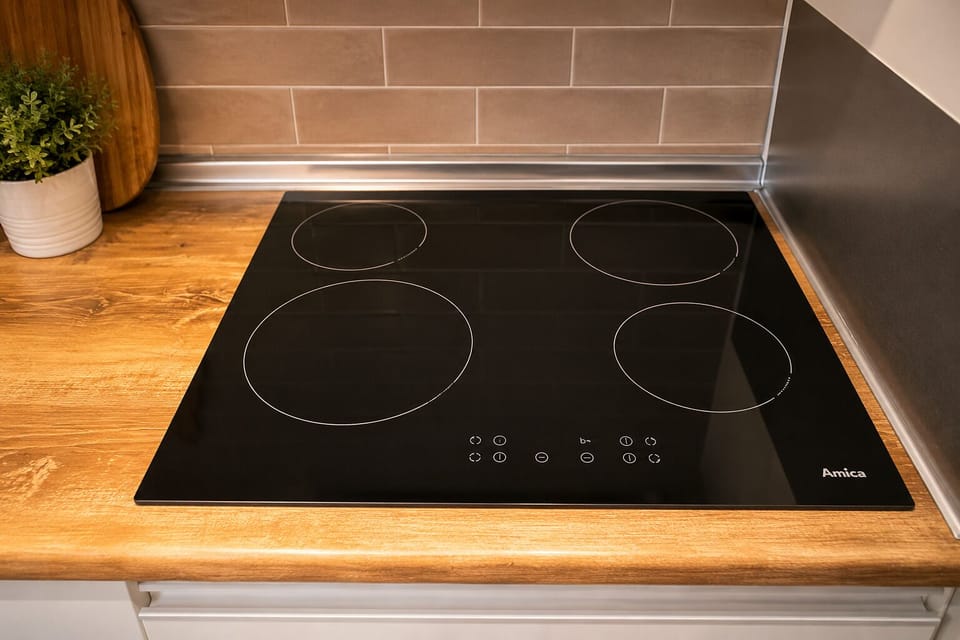 Comfort Apartment | Private kitchen | Electric kettle, dining tables