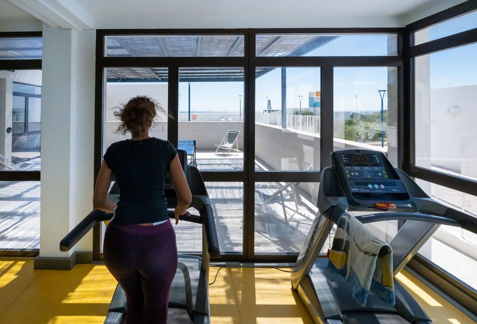 The on-site fitness room with sea views — stay active while enjoying the Mediterranean light.