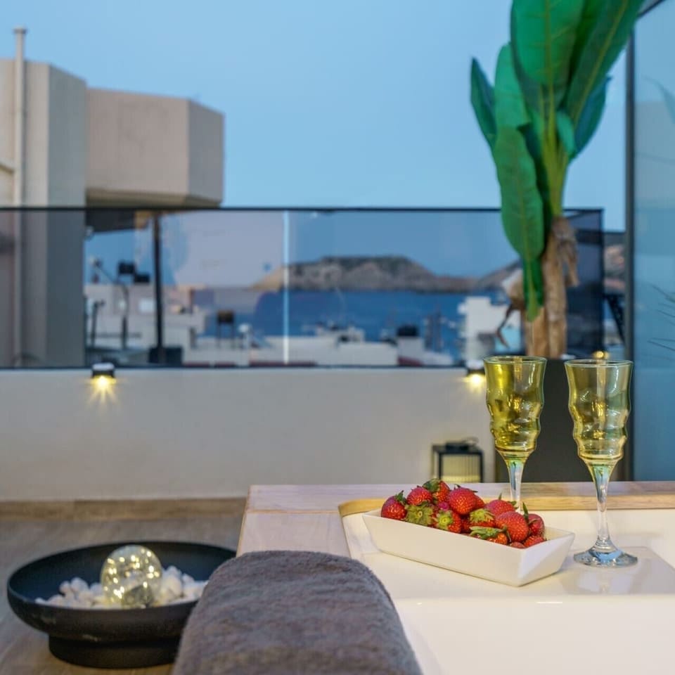 Enjoy a glass of wine while relaxing in your private jacuzzi