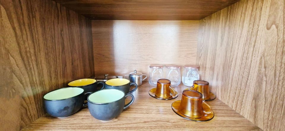 Basic Apartment | Private kitchen | Fridge, microwave, cookware/dishes/utensils, dining tables