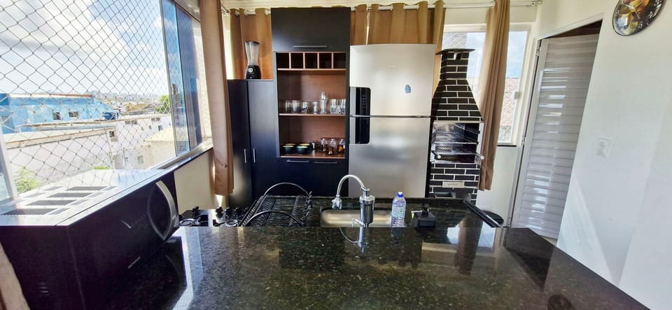 Basic Apartment | Private kitchen | Fridge, microwave, cookware/dishes/utensils, dining tables