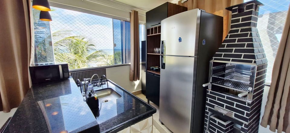 Basic Apartment | Private kitchen | Fridge, microwave, cookware/dishes/utensils, dining tables