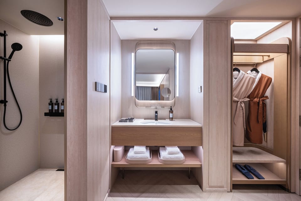Shower, hair dryer, slippers, towels