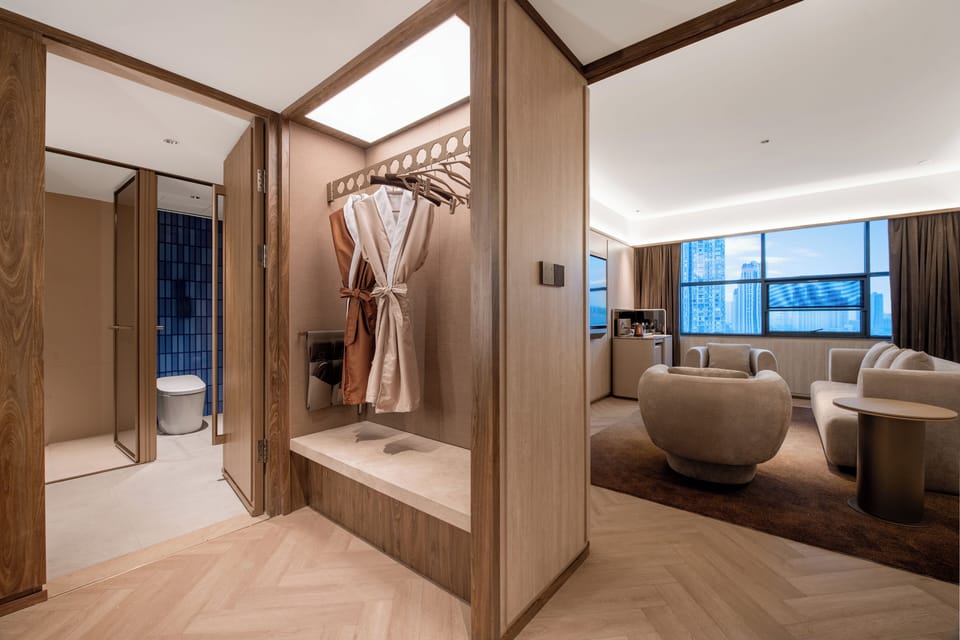 Executive Suite | Bathroom | Hair dryer, slippers, towels, shampoo