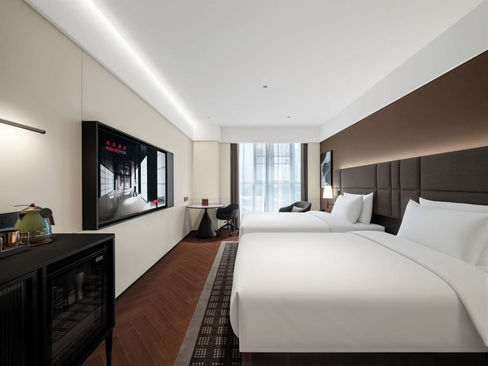 Premium bedding, down comforters, memory foam beds, minibar (free items)